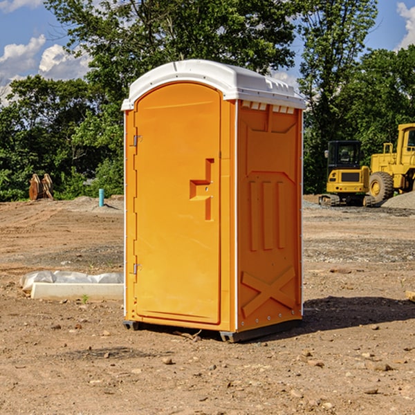 what is the cost difference between standard and deluxe portable restroom rentals in Mora